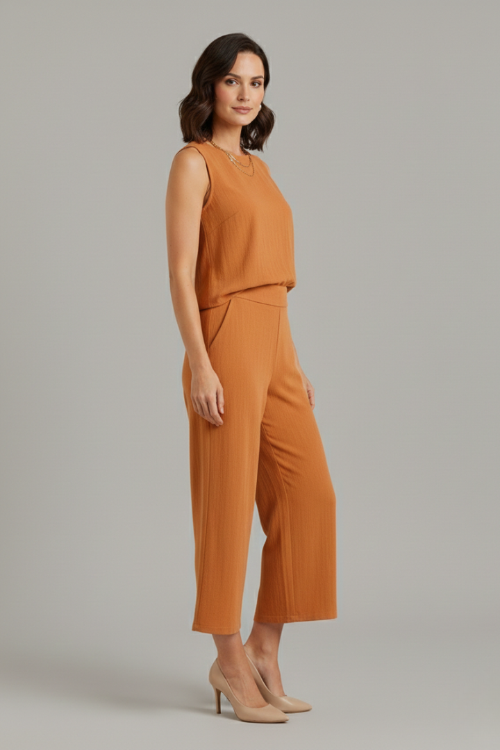 Women’s beige two-piece set from THE WHITMORE FAMILY featuring a sleeveless top and cropped trousers, casual and stylish.