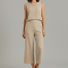 Women’s beige two-piece set by THE WHITMORE FAMILY featuring a sleeveless top and cropped trousers, casual and stylish.