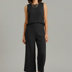 Beige women's two-piece set by THE WHITMORE FAMILY featuring a sleeveless top and cropped trousers, stylish and comfortable.