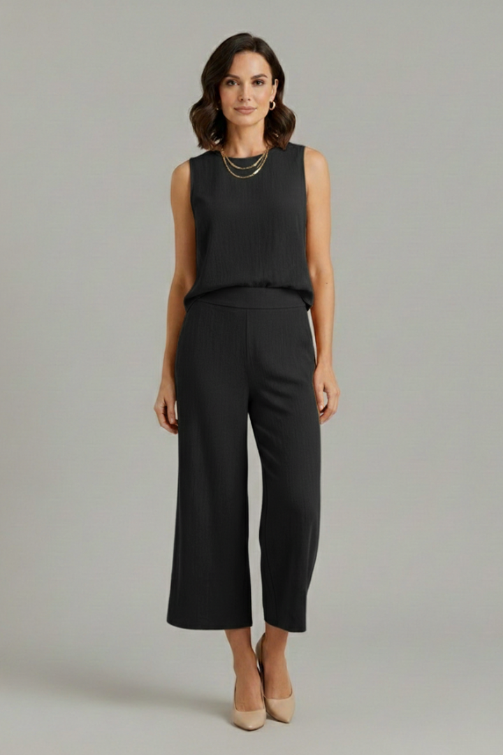 Beige women's two-piece set by THE WHITMORE FAMILY featuring a sleeveless top and cropped trousers, stylish and comfortable.