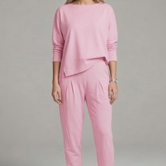 Women’s black two-piece set with crew neck top and tapered trousers by THE WHITMORE FAMILY, shown on a model.