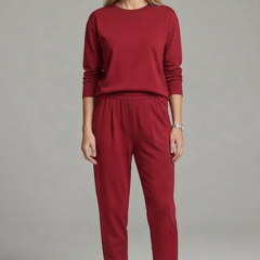 Women’s black two-piece set with crew neck top and tapered trousers, stylish and comfortable from THE WHITMORE FAMILY.