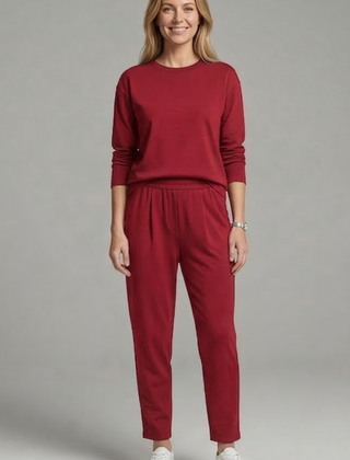 Women’s black two-piece set with crew neck top and tapered trousers, stylish and comfortable from THE WHITMORE FAMILY.