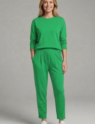 Black women's two-piece set with crew neck top and tapered trousers by THE WHITMORE FAMILY, casual stylish outfit.