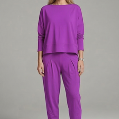 Women’s black two-piece set with crew neck top and tapered trousers by THE WHITMORE FAMILY, shown on a model.