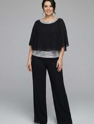 Women's two-piece set by THE WHITMORE FAMILY with an embellished neckline and wide-leg trousers, in black.