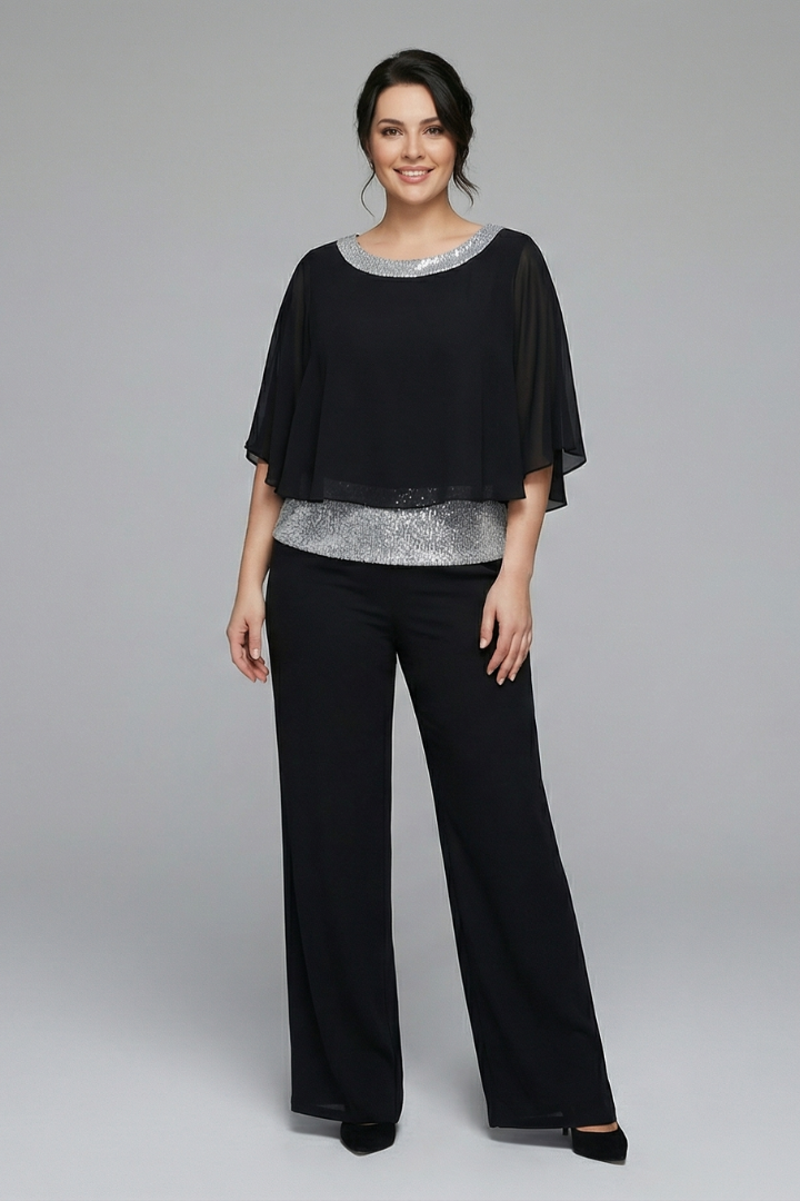 Women's two-piece set by THE WHITMORE FAMILY with an embellished neckline and wide-leg trousers, in black.