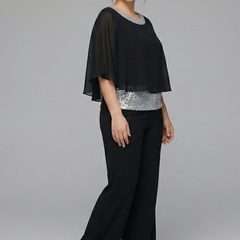 Women’s two-piece set by THE WHITMORE FAMILY featuring an embellished neckline and wide-leg trousers, shown on a model.