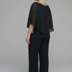Women’s black two-piece set with embellished neckline and wide-leg trousers by THE WHITMORE FAMILY, shown on a model.
