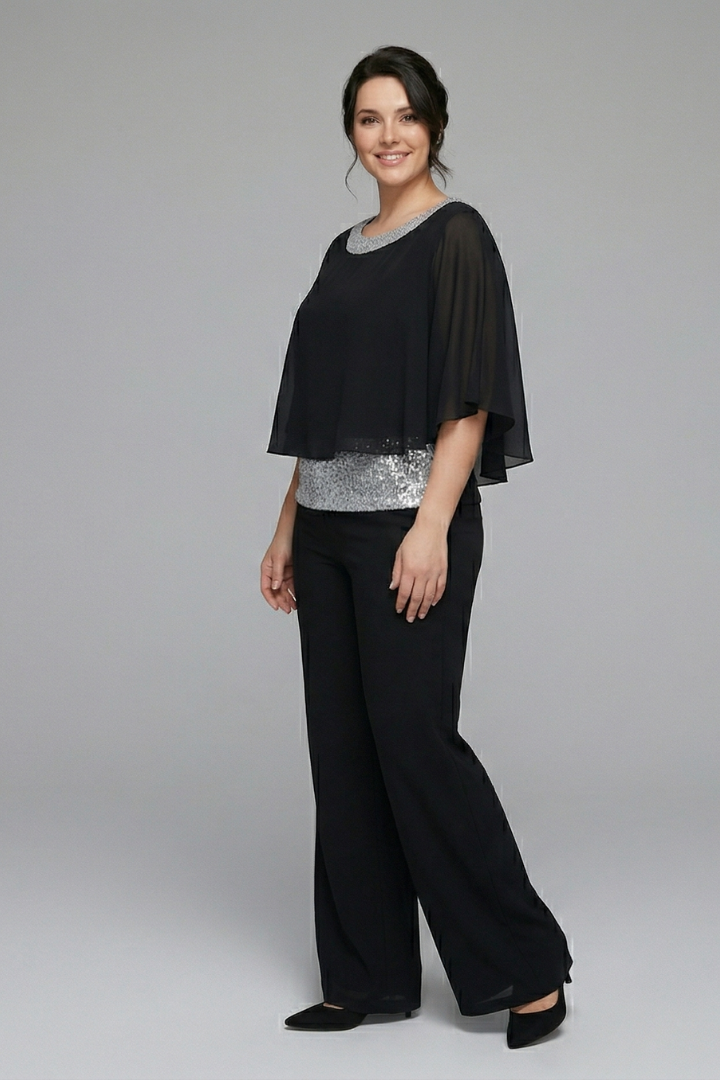 Women’s black two-piece set with embellished neckline and wide-leg trousers from THE WHITMORE FAMILY.