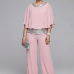 Women’s two-piece set by THE WHITMORE FAMILY featuring an embellished neckline and wide-leg trousers in black.