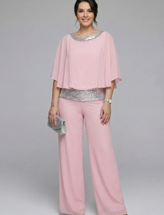 Women’s two-piece set by THE WHITMORE FAMILY featuring an embellished neckline and wide-leg trousers in black.