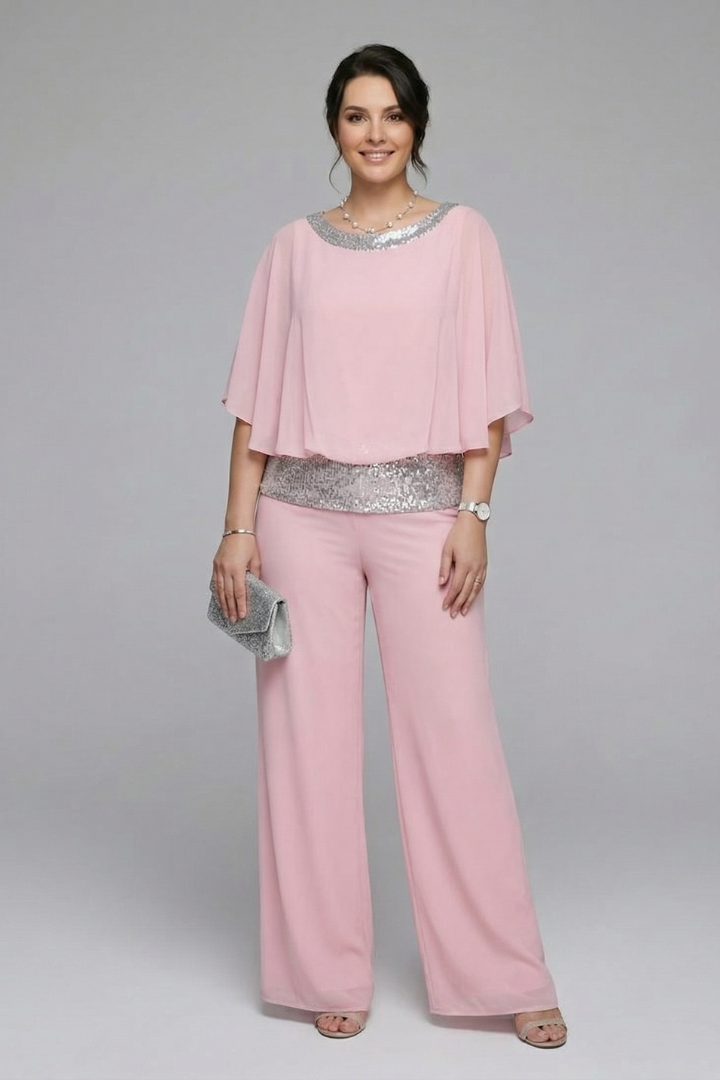 Women’s two-piece set by THE WHITMORE FAMILY featuring an embellished neckline and wide-leg trousers in black.