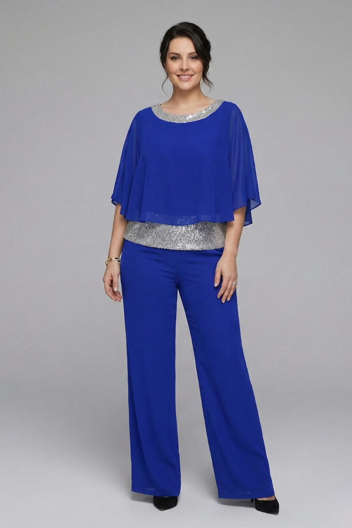 Women's two-piece set by THE WHITMORE FAMILY featuring an embellished neckline and wide-leg trousers in black.