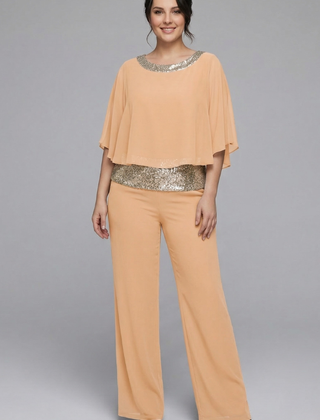 Women’s black two-piece set with embellished neckline and wide-leg trousers by THE WHITMORE FAMILY, shown on a model.
