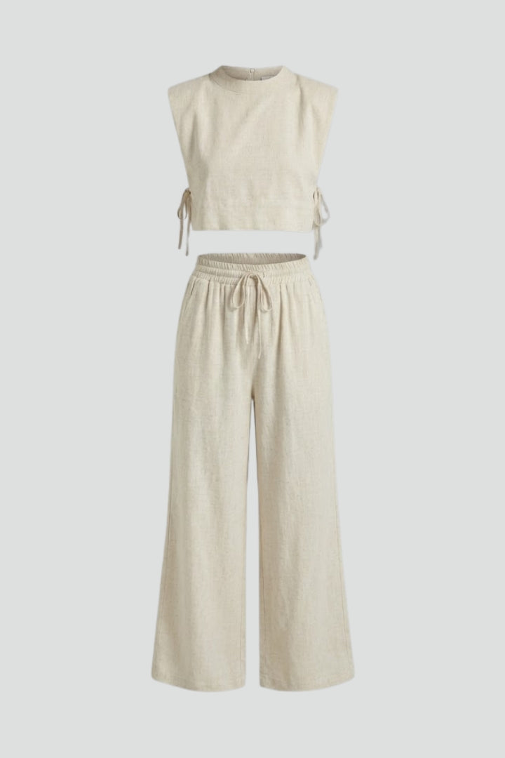 Women’s cream two-piece set by THE WHITMORE FAMILY featuring a sleeveless top and wide-leg pants, casual and stylish.