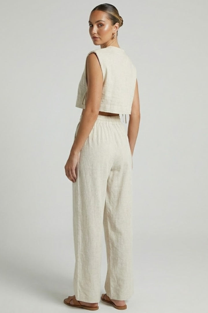 Cream women's two-piece set by THE WHITMORE FAMILY featuring a sleeveless top and wide-leg pants.