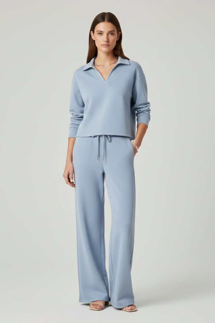 Women’s two-piece set with a V-neck top and wide-leg pants by THE WHITMORE FAMILY, featuring stylish, comfortable fabric.