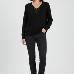 Women's V-neck sweater with long sleeves and pullover design by THE WHITMORE FAMILY, shown in a cozy, stylish fit.