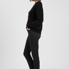 Women’s V-Neck Sweater with long sleeves and pullover design from THE WHITMORE FAMILY, shown in a cozy knit style.