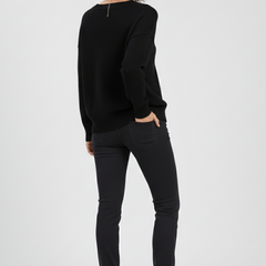 Women’s V-neck sweater with long sleeves and pullover style from THE WHITMORE FAMILY, showcasing a cozy knit design.
