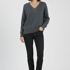 Women’s V-neck sweater with long sleeves and pullover design by THE WHITMORE FAMILY, shown in a cozy, stylish fit.