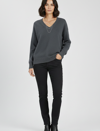 Women’s V-neck sweater with long sleeves and pullover design by THE WHITMORE FAMILY, shown in a cozy, stylish fit.