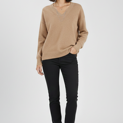 Women’s V-neck sweater with long sleeves and pullover design by THE WHITMORE FAMILY, shown in a cozy, stylish fit.