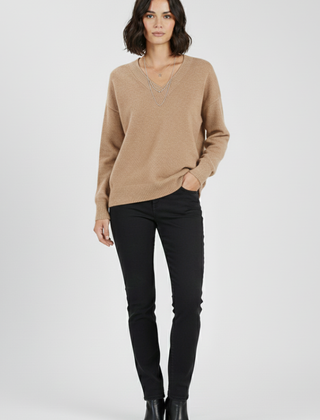 Women’s V-neck sweater with long sleeves and pullover design by THE WHITMORE FAMILY, shown in a cozy, stylish fit.