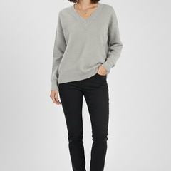 Women’s V-Neck sweater with long sleeves and pullover design, crafted by THE WHITMORE FAMILY, shown in a cozy knit fabric.