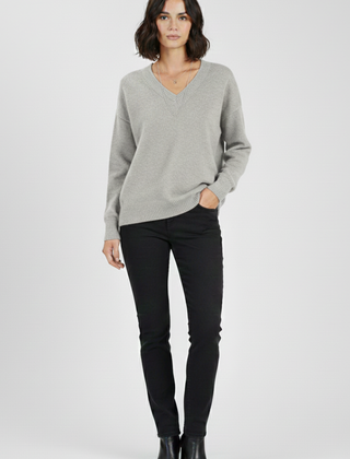 Women’s V-Neck sweater with long sleeves and pullover design, crafted by THE WHITMORE FAMILY, shown in a cozy knit fabric.