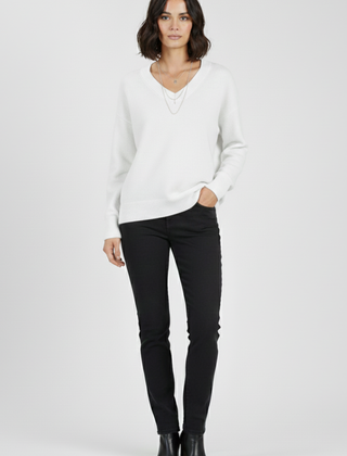 Women’s V-neck sweater with long sleeves and pullover style, from THE WHITMORE FAMILY, featuring a cozy and classic design.