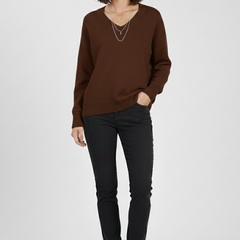 Women's V-neck sweater with long sleeves and pullover design by THE WHITMORE FAMILY, featuring a cozy knit fabric in a classic style.