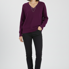 Women’s V-neck sweater with long sleeves and pullover design by THE WHITMORE FAMILY, shown in a cozy knit style.