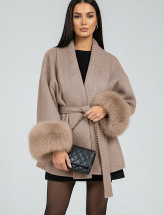 Beige women's belted full-length coat with waist tie from THE WHITMORE FAMILY, stylish winter jacket for women.