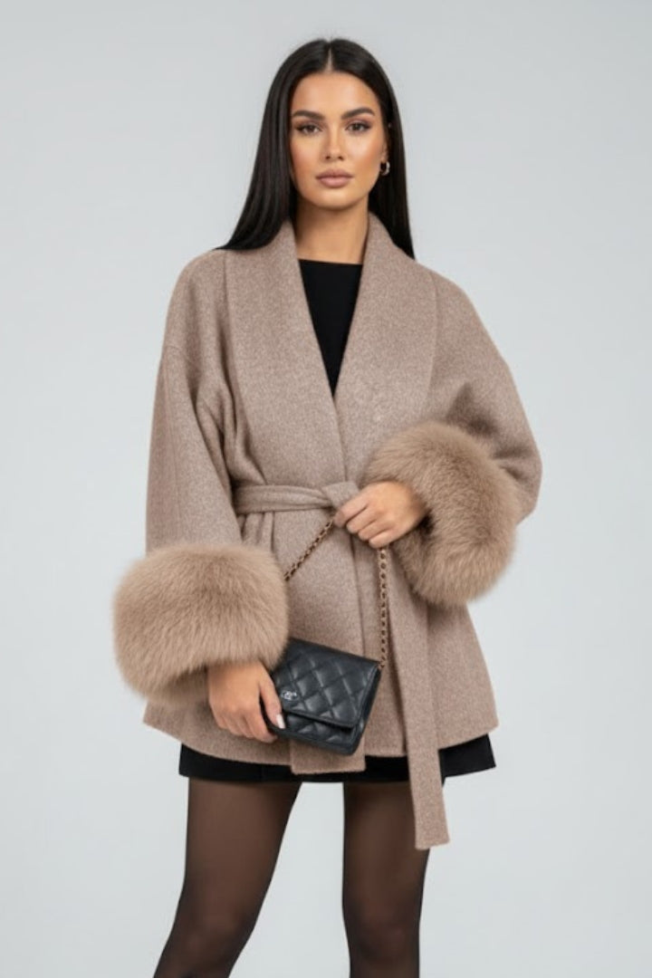 Beige women's belted full-length coat with waist tie from THE WHITMORE FAMILY, stylish winter jacket for women.