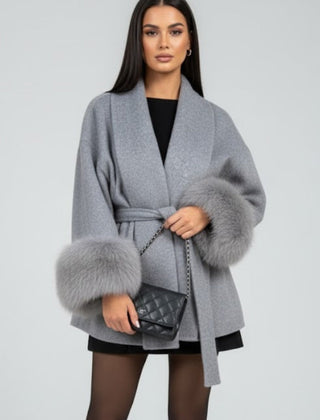 Beige women's full-length coat with waist tie and belt from THE WHITMORE FAMILY, shown with a front view and stylish design.
