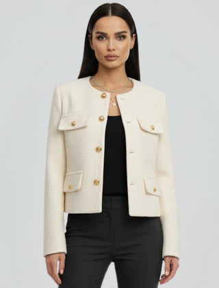 Women’s black cropped jacket with button front by THE WHITMORE FAMILY, featuring a stylish, fitted design and long sleeves.