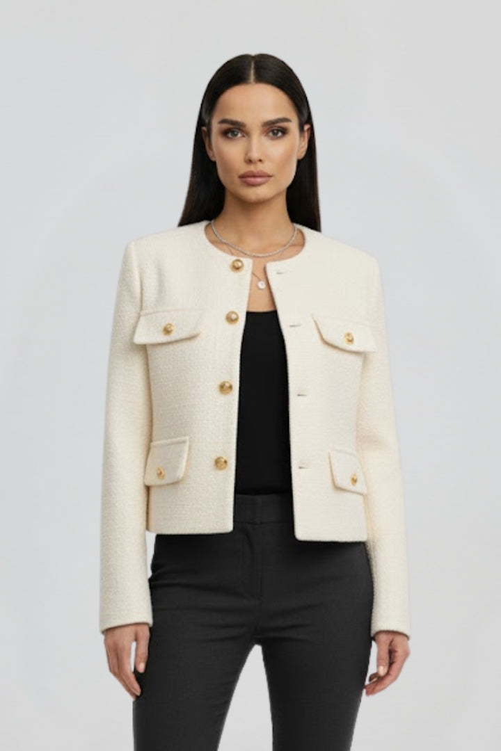 Women’s black cropped jacket with button front by THE WHITMORE FAMILY, featuring a stylish, fitted design and long sleeves.