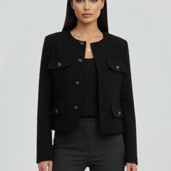 Black women's cropped jacket with button front from THE WHITMORE FAMILY, styled with a fitted silhouette and long sleeves.
