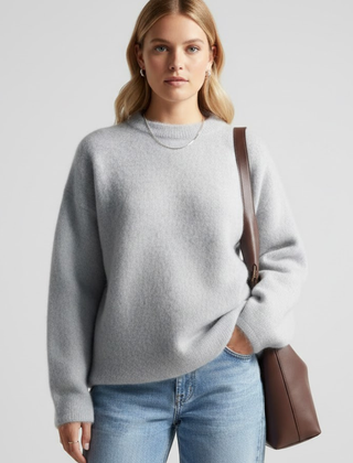 Women’s oversized knitted sweater with a round neckline and dropped shoulders, stylish and cozy from THE WHITMORE FAMILY.