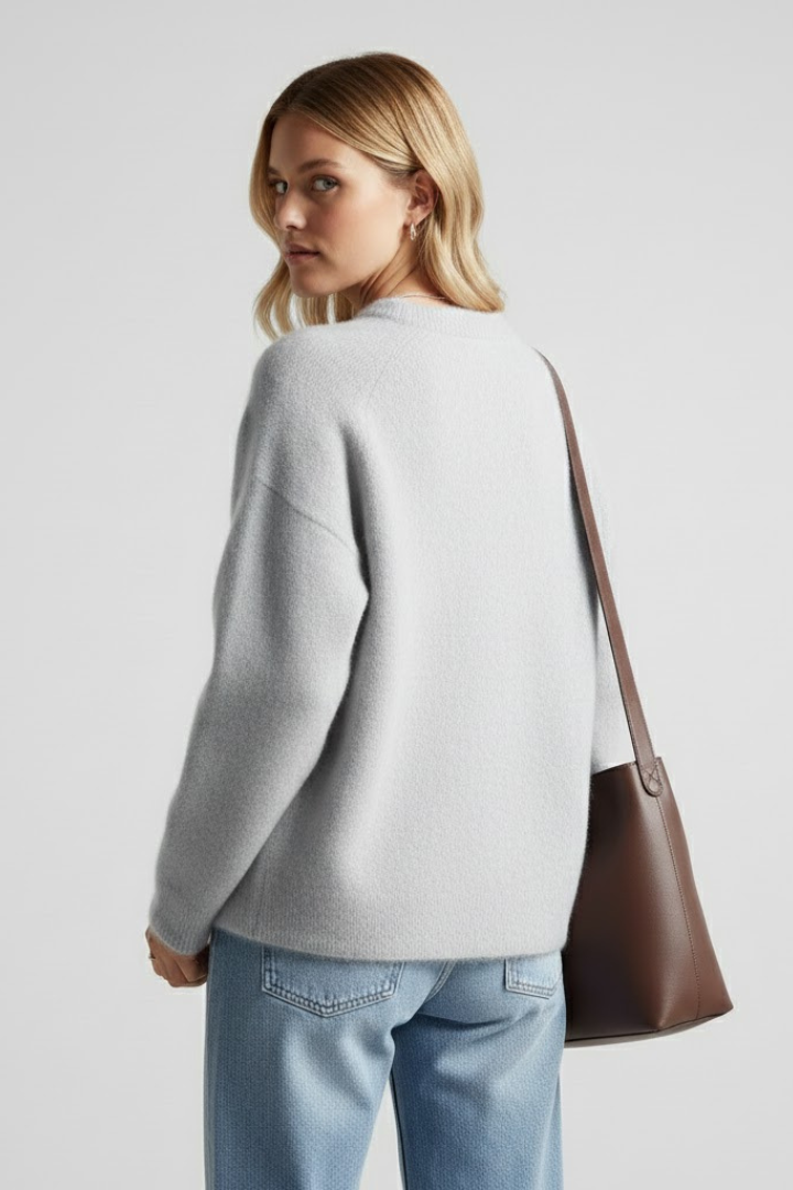 Women’s knitted sweater with round neckline and dropped shoulders, oversized style from THE WHITMORE FAMILY.