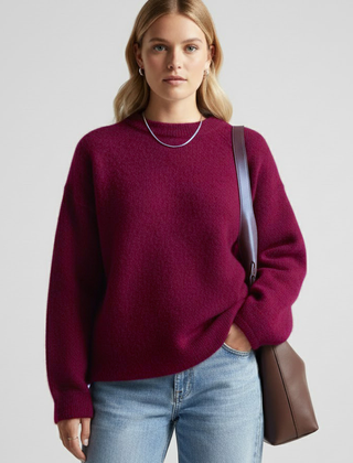Women’s oversized knitted sweater with round neckline and dropped shoulders, by THE WHITMORE FAMILY, showcasing soft, cozy knit fabric.