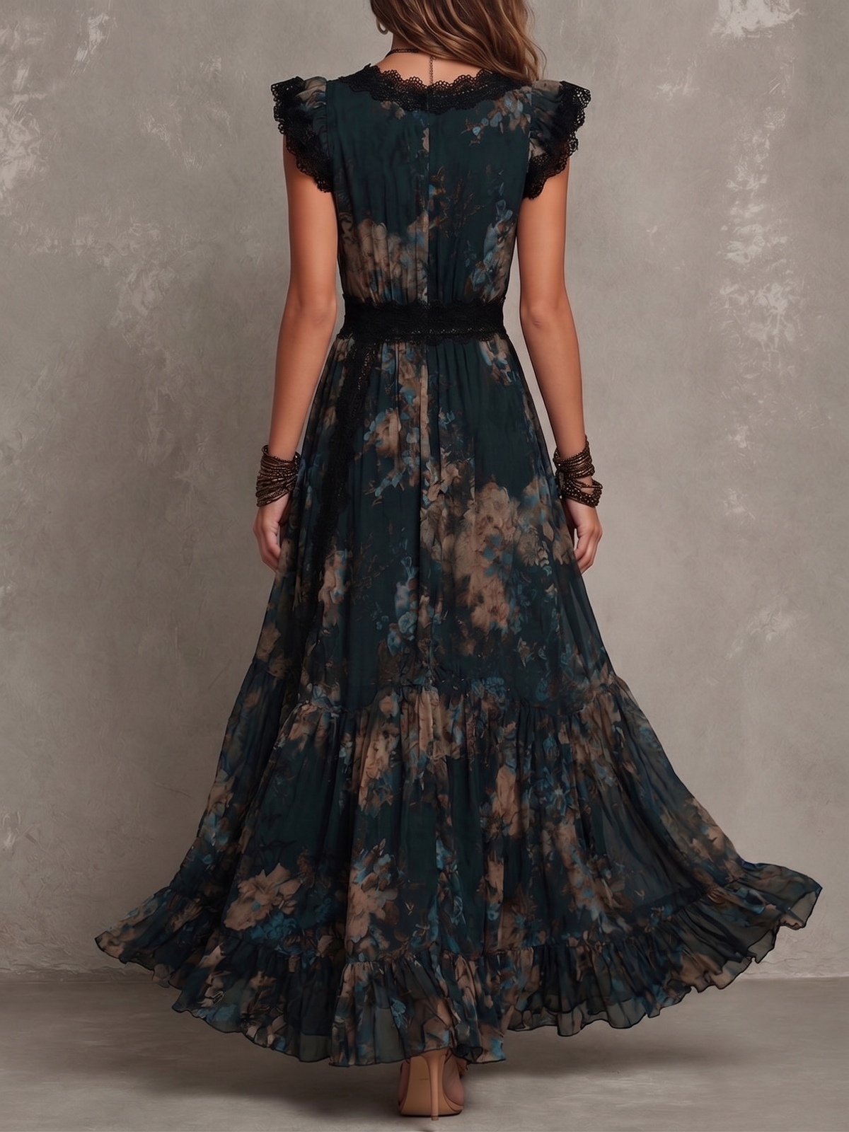 Gillian™ Maxi Dress by THE WHITMORE FAMILY, flowing fabric, sleeveless design, and ankle-length silhouette in a stylish pattern.