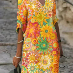 Nira vibrant floral midi dress by THE WHITMORE FAMILY featuring yellow fabric and a stylish, flowing design.