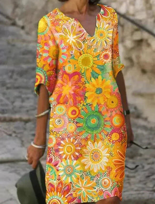 Nira vibrant floral midi dress by THE WHITMORE FAMILY featuring yellow fabric and a stylish, flowing design.