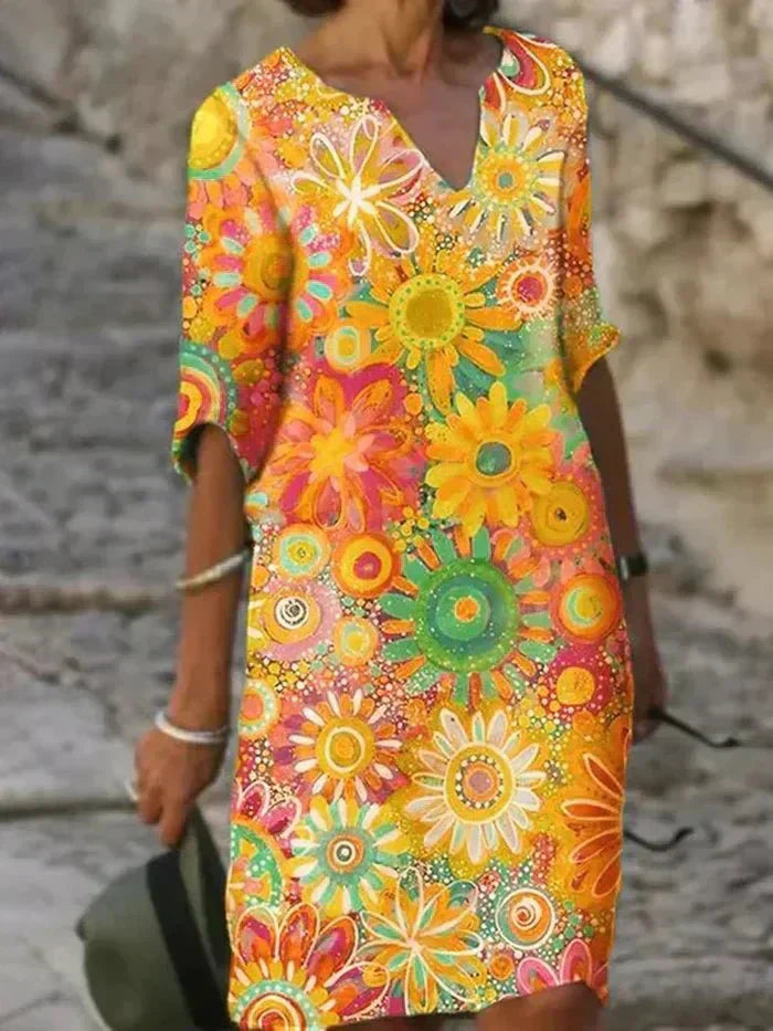 Nira vibrant floral midi dress by THE WHITMORE FAMILY featuring yellow fabric and a stylish, flowing design.