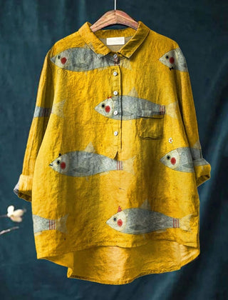 Yellow playful fish shirt for kids from THE WHITMORE FAMILY, featuring colorful fish print on soft fabric.