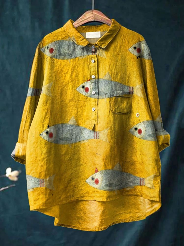 Yellow playful fish shirt for kids from THE WHITMORE FAMILY, featuring colorful fish print on soft fabric.