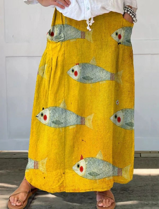 Elli™ vintage fish art print pocket skirt by THE WHITMORE FAMILY, yellow fabric with fish illustration and side pockets.